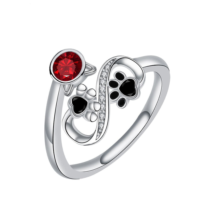 Adjustable Ring with Black Paw Print Design and Red Gemstone